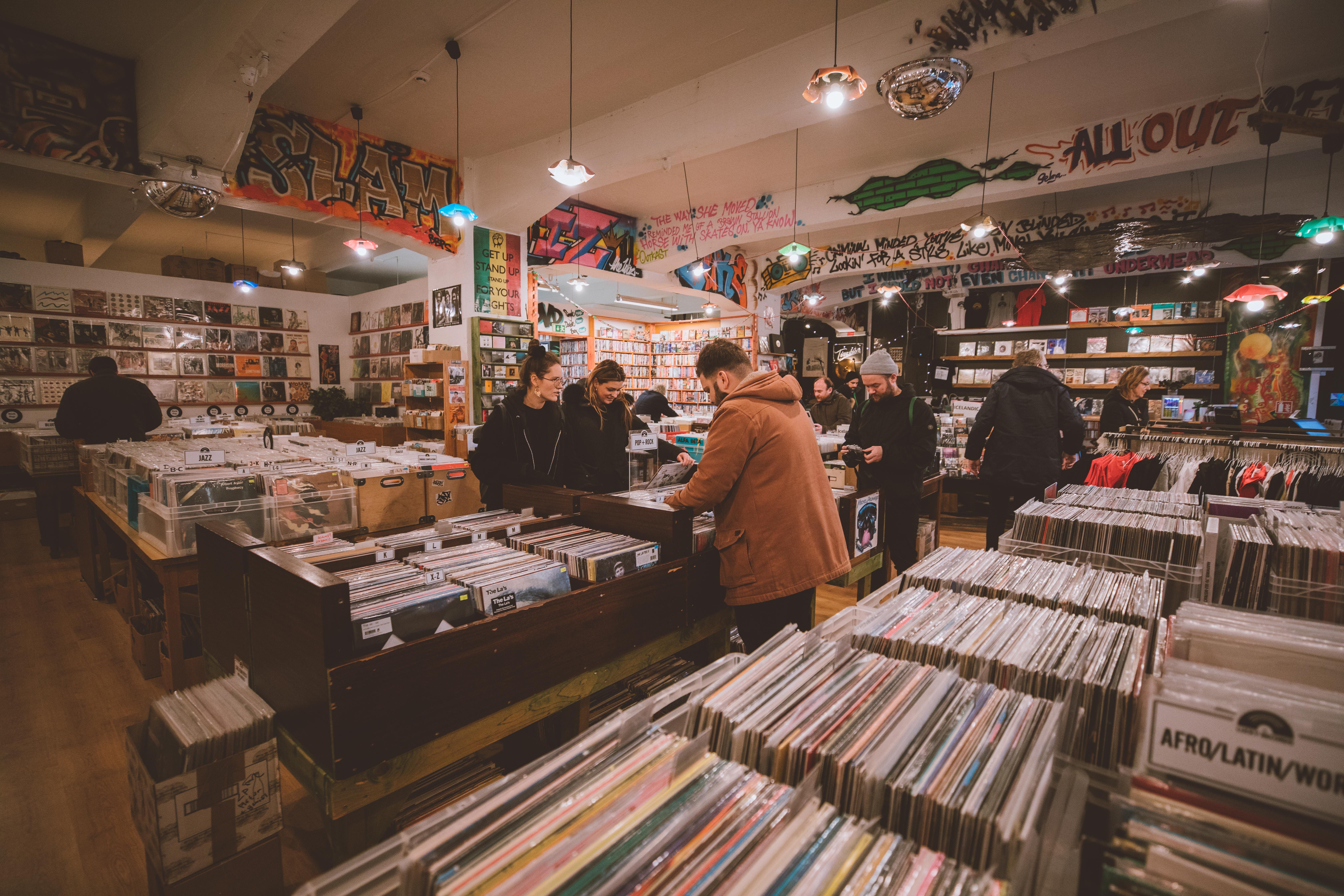 People browsing through records in a record store 