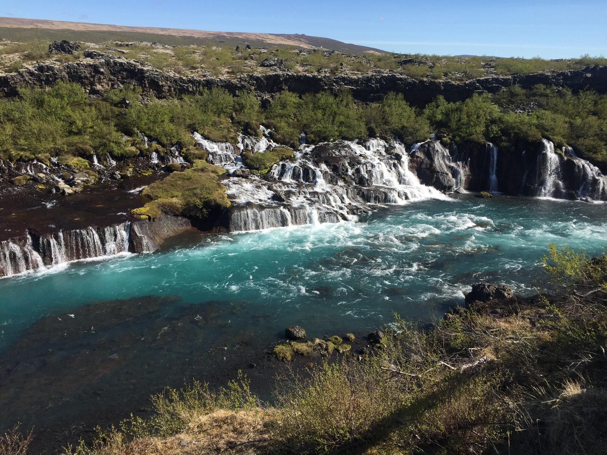 Turqouise waters of Hraunfossar waterfalls