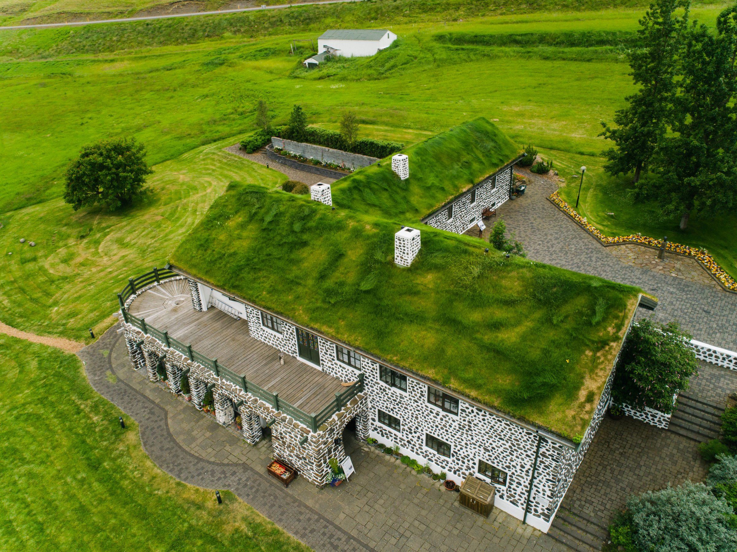 Aerial view of the Skriðuklaustur house with grass on the roof
