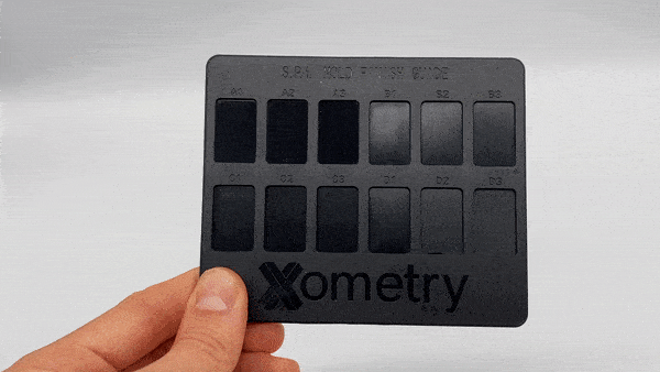 Xometry injection molding finishes card with SPI on the front and VDI 3400 on the back