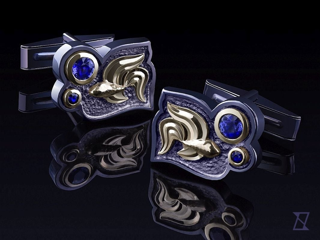 Siamese fighting fish cufflinks featuring Ceylon sapphires.